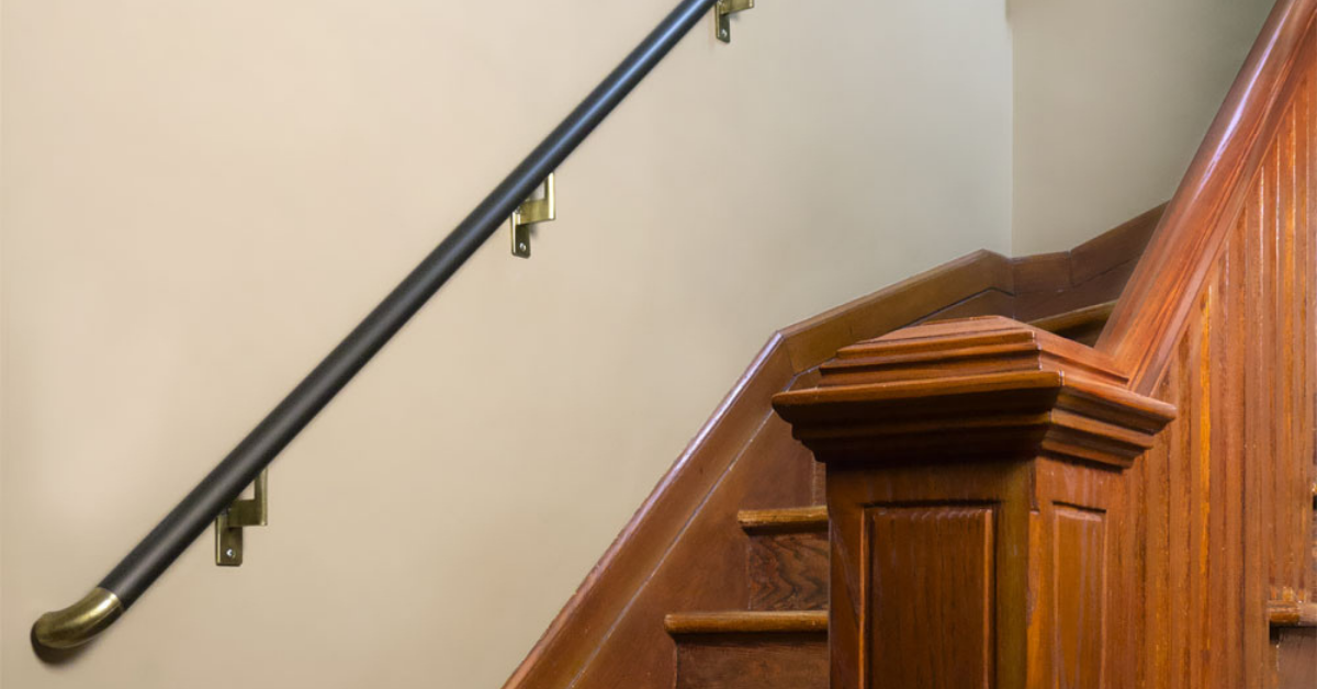 A handrail going up a set of stairs