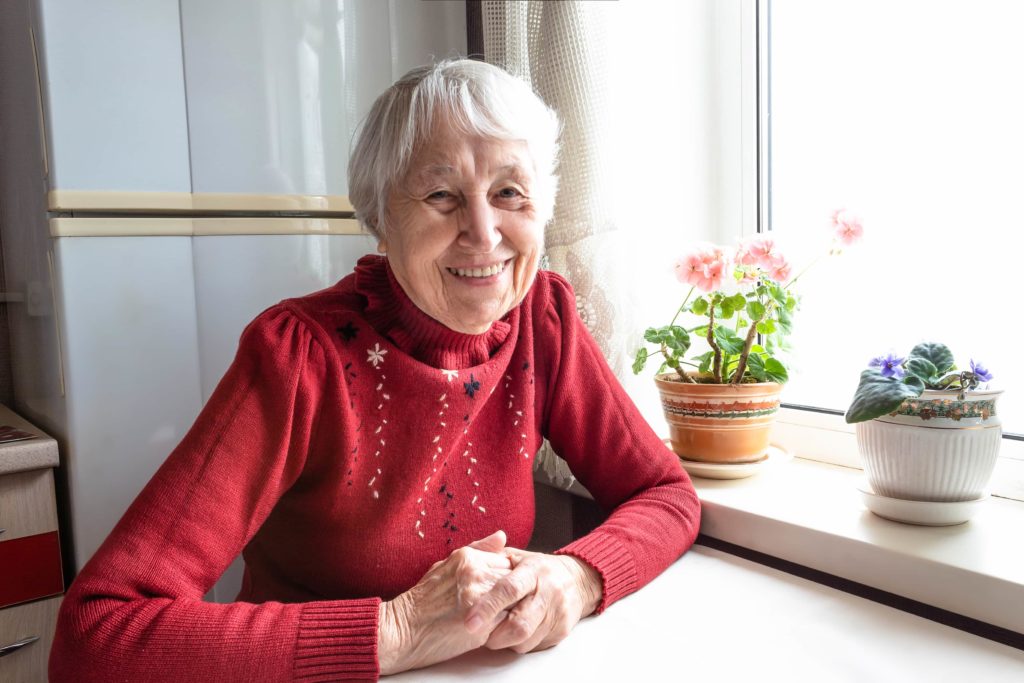 Elderly Woman in Red Sweater