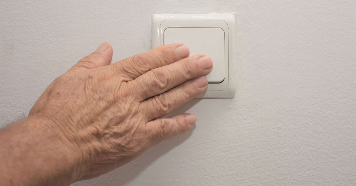 Elderly Hand Light Switch