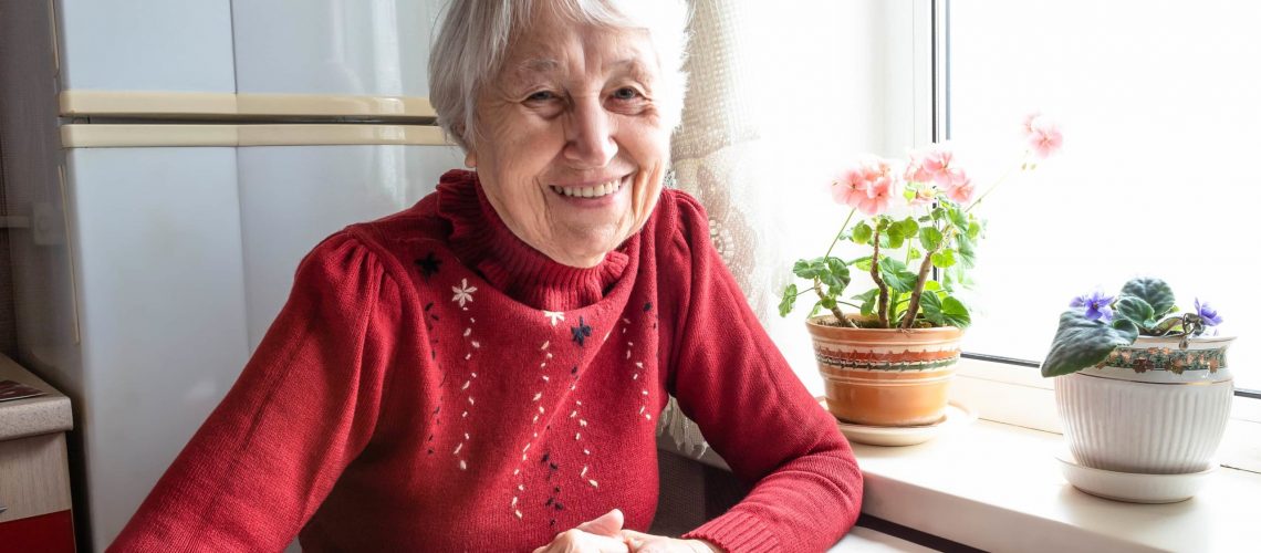 Elderly Woman in Red Sweater